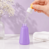 hand-filling-a-purple-50ml-pet-dropper-bottle.png