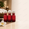 three-red-120ml-pet-essential-oil-bottles-displayed-in-a-spa.png