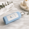 blue-ribbed-pet-hotel-lotion-pump-bottle-lying-on-marble-counter.png