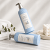 two-blue-ribbed-pet-hotel-lotion-pump-bottles-on-marble-counter.png