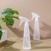 two-clear-350ml-pp-fine-mist-trigger-spray-bottles-beside-plants.jpg