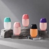 colorful-50ml-pp-pocket-spray-bottles-on-gray-stone-display-blocks.jpg