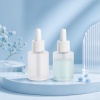 two-frosted-50ml-all-pp-dropper-bottles-in-a-blue-skincare-scene.jpg