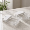 two-clear-38ml-petg-card-spray-bottles-lying-on-a-marble-surface.jpg