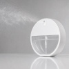 white-30ml-round-card-spray-bottle-producing-a-fine-mist.jpg