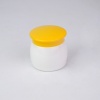 yellow-and-white-pp-cosmetic-cream-jar-on-white-background.jpg