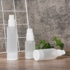 three-frosted-pp-airless-lotion-bottles-with-one-bottle-lying-down.jpg