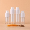 four-clear-and-frosted-twist-up-airless-skincare-bottles-with-raised-pumps.jpg