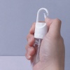 hand-operating-clear-clip-on-travel-spray-bottle.jpeg