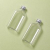 two-flat-pet-beverage-bottles-on-sage-background.jpg