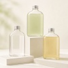 three-flat-pet-juice-bottles-with-clear-and-colored-drinks.jpg