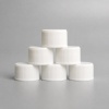 white-flat-top-packaging-caps-in-group.jpg