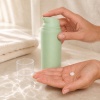 pp-airless-pump-bottle-dispensing-skincare-lotion-into-a-hand.jpg