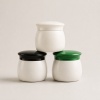 three-stacked-pp-double-wall-cream-jars-with-black-green-and-white-lids.jpg