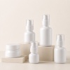 white-pet-skincare-bottles-and-jar-arranged-on-display-blocks.jpg
