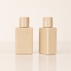 two-natural-wheat-straw-composite-bottles-on-reflective-surface.jpg