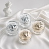 four-gold-and-silver-acrylic-crystal-cosmetic-jars-on-satin.jpg