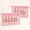 eleven-piece-pink-travel-bottle-set-packed-in-clear-pouches.jpg