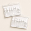white-eleven-piece-travel-container-sets-in-transparent-pouches.jpg