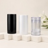 black-white-and-clear-solid-cosmetic-stick-container-hero-image.jpg