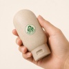 60ml-wheat-straw-composite-travel-bottle-held-in-hand.jpg
