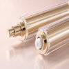 gold-cosmetic-pump-and-inner-dispensing-mechanism-closeup.jpg