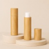 4g-5g-bamboo-lip-balm-tube-shown-open-and-closed-on-a-neutral-display.jpg