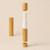 4g-5g-bamboo-lip-balm-tube-shown-with-separated-packaging-components.jpg