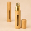 5ml-10ml-bamboo-perfume-and-essential-oil-spray-bottle-with-gold-sprayer-and-visible-fill-window.jpg