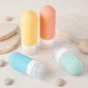 90ml-silicone-travel-toiletry-bottle-set-pastel-squeeze-tubes-in-a-travel-lifestyle-scene.jpg