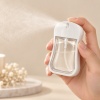25ml-to-50ml-flat-card-perfume-spray-bottle-showing-fine-mist-spray-effect.jpg