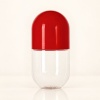 520ml-clear-pet-capsule-shaped-candy-and-supplement-jar-showing-empty-red-capsule.jpg