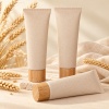 wheat-straw-composite-cosmetic-squeeze-tube-with-bamboo-cap-shown-in-a-group-display.jpg