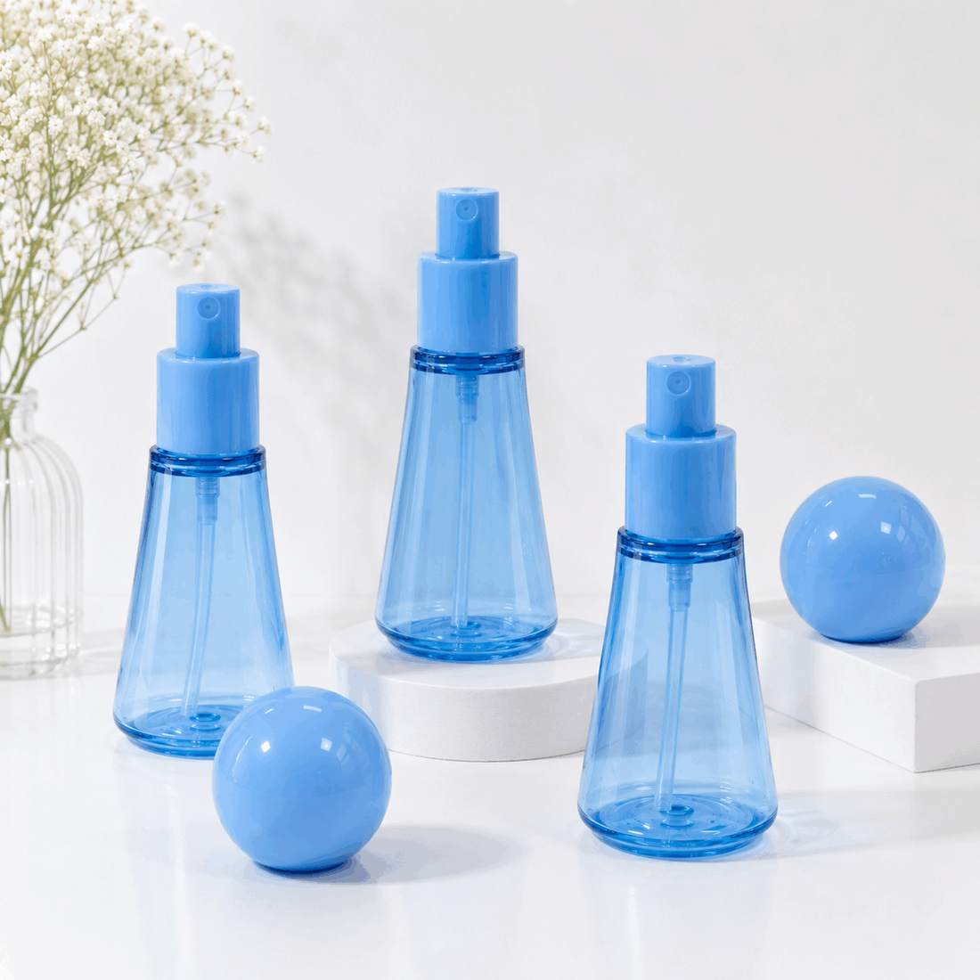 three-blue-50ml-pet-fine-mist-spray-bottles-with-spherical-caps