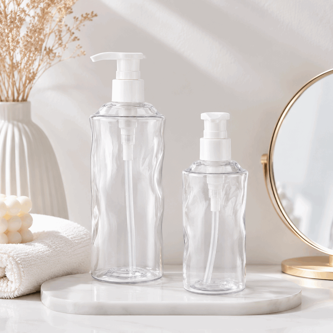 clear-300ml-and-500ml-pet-water-ripple-lotion-pump-bottles-on-bathroom-counter
