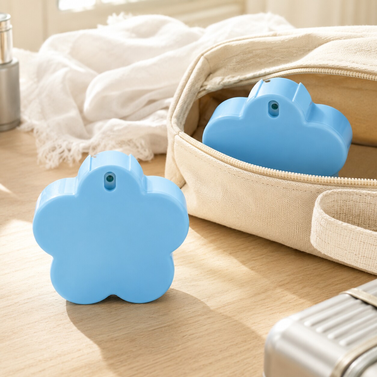 blue-50ml-pp-flower-shaped-travel-spray-bottles-beside-cosmetic-pouch