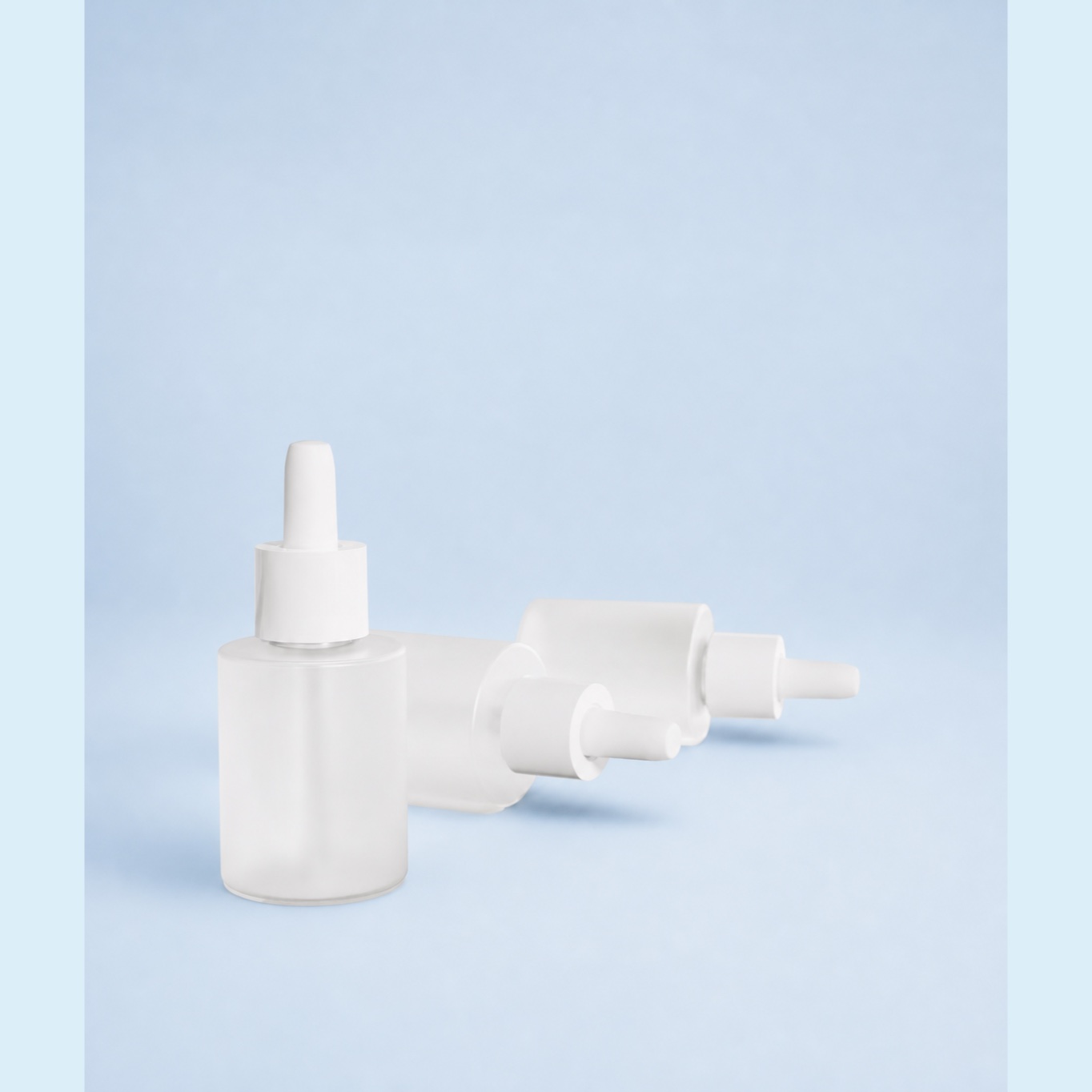 white-50ml-all-pp-dropper-bottle-and-components-arranged-on-blue-background
