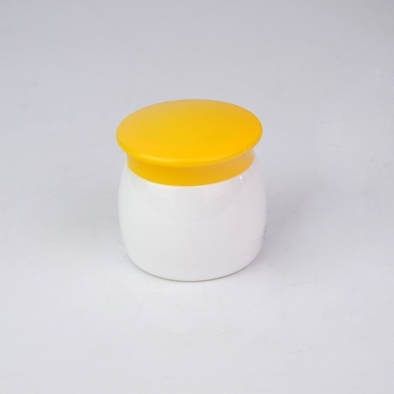 yellow-and-white-pp-cosmetic-cream-jar-on-white-background