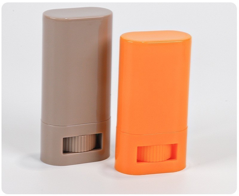 taupe-and-orange-oval-deodorant-stick-containers-with-twist-wheels
