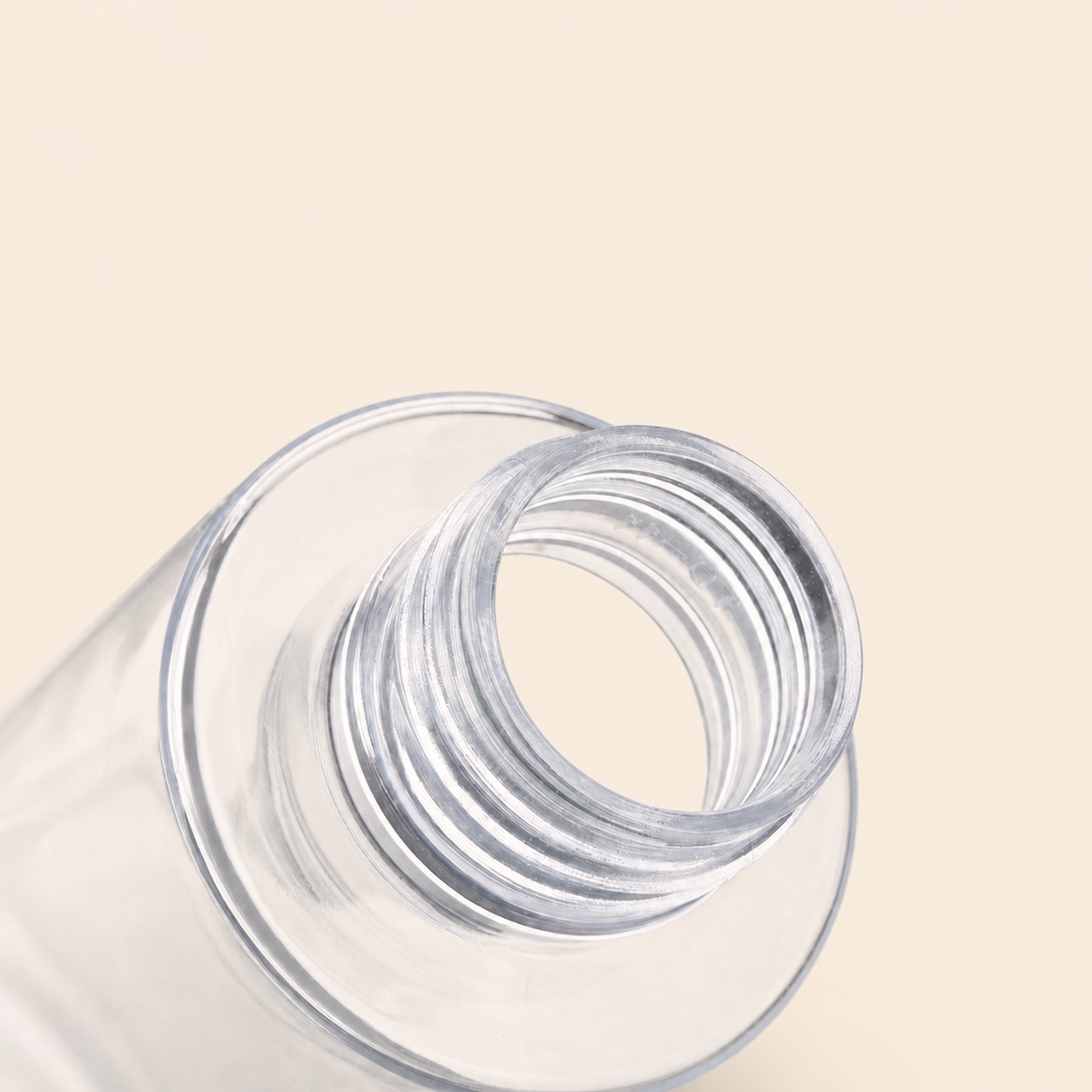 threaded-neck-detail-of-clear-pet-cosmetic-bottle