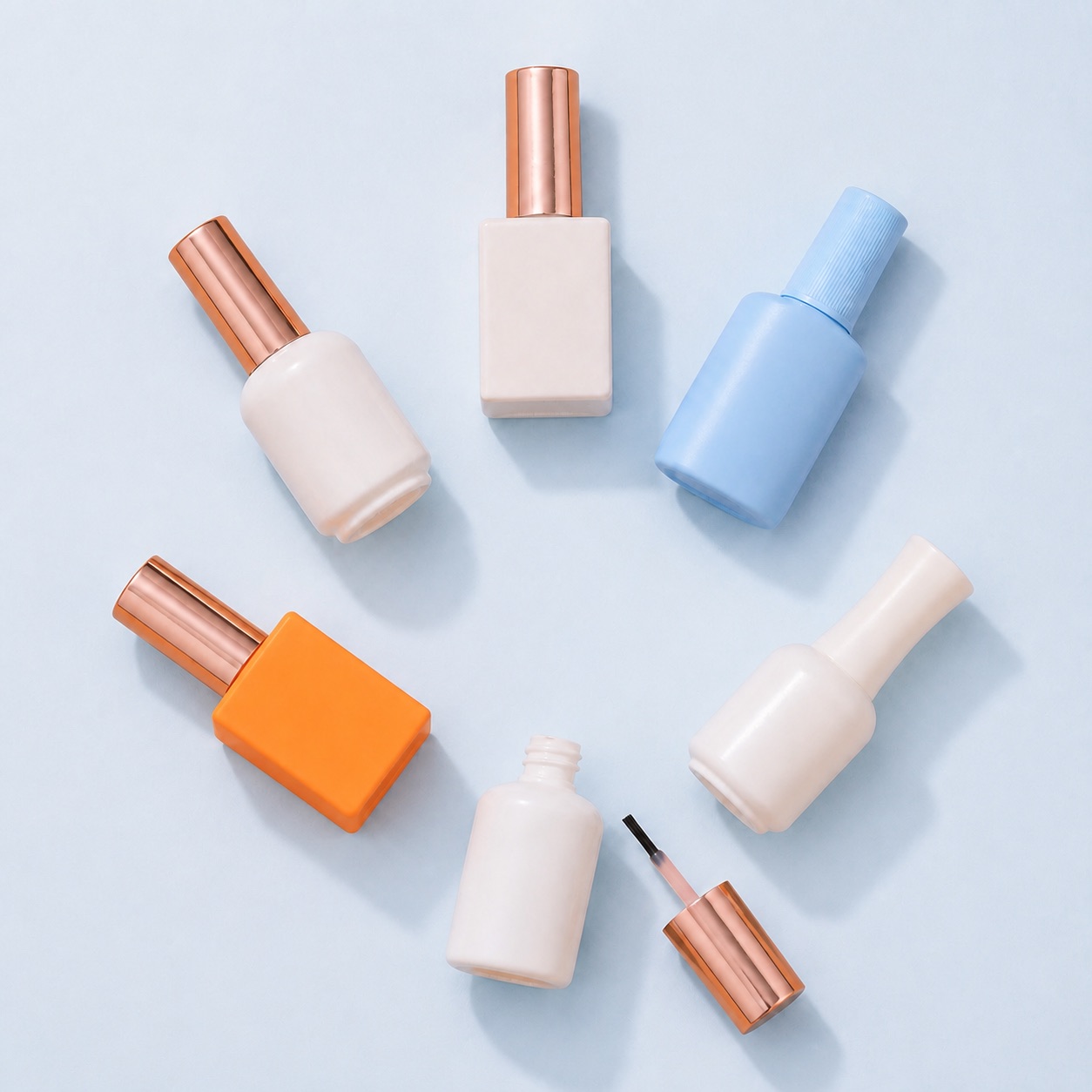 round-and-square-pe-nail-polish-bottles-flat-lay