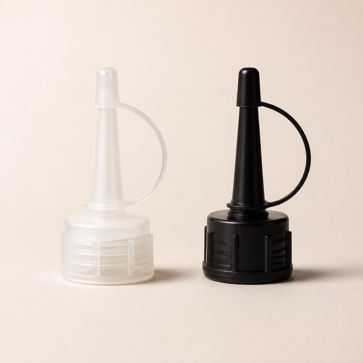 clear-and-black-pp-nozzle-caps-with-tethered-plugs