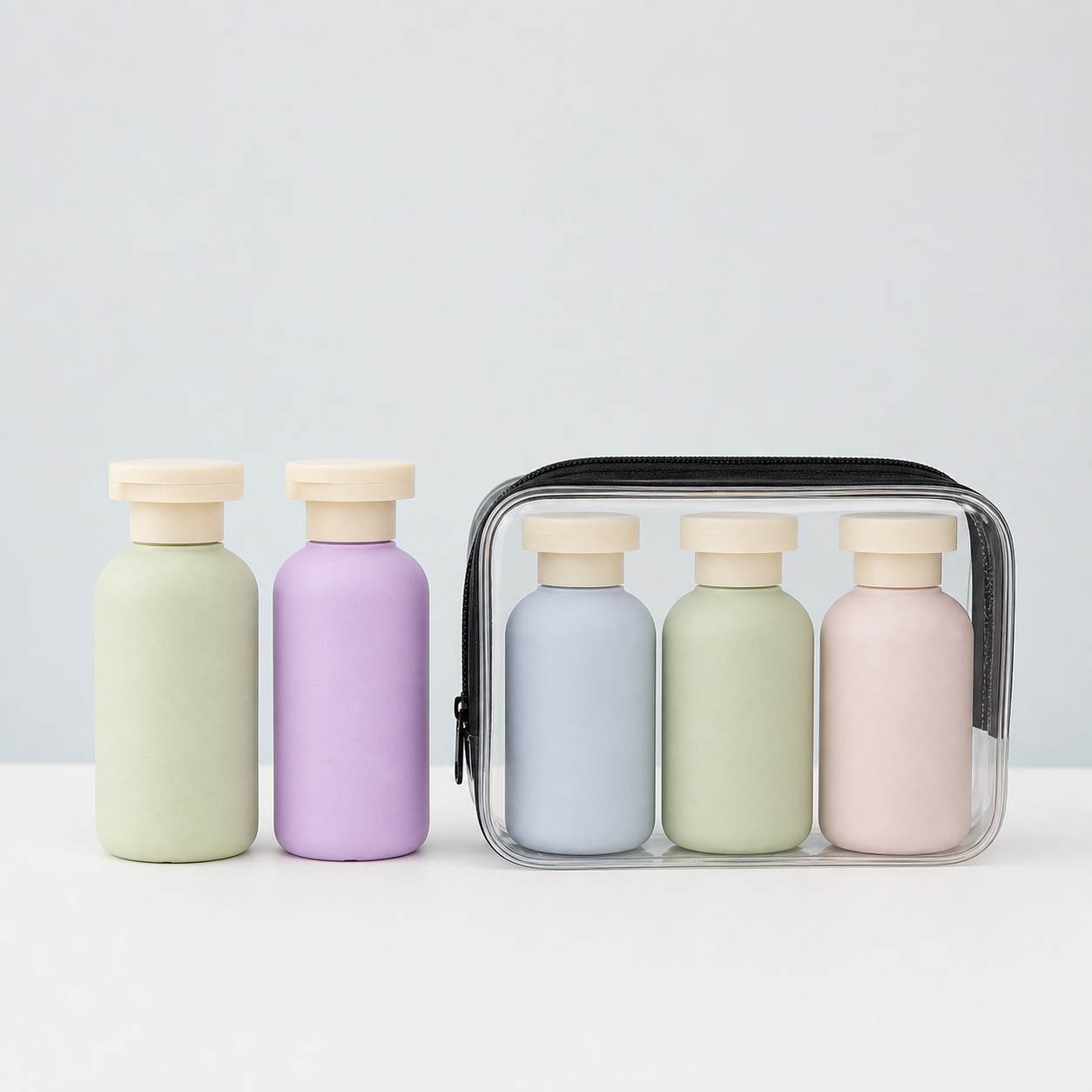 pastel-wheat-straw-travel-bottles-in-clear-toiletry-bag