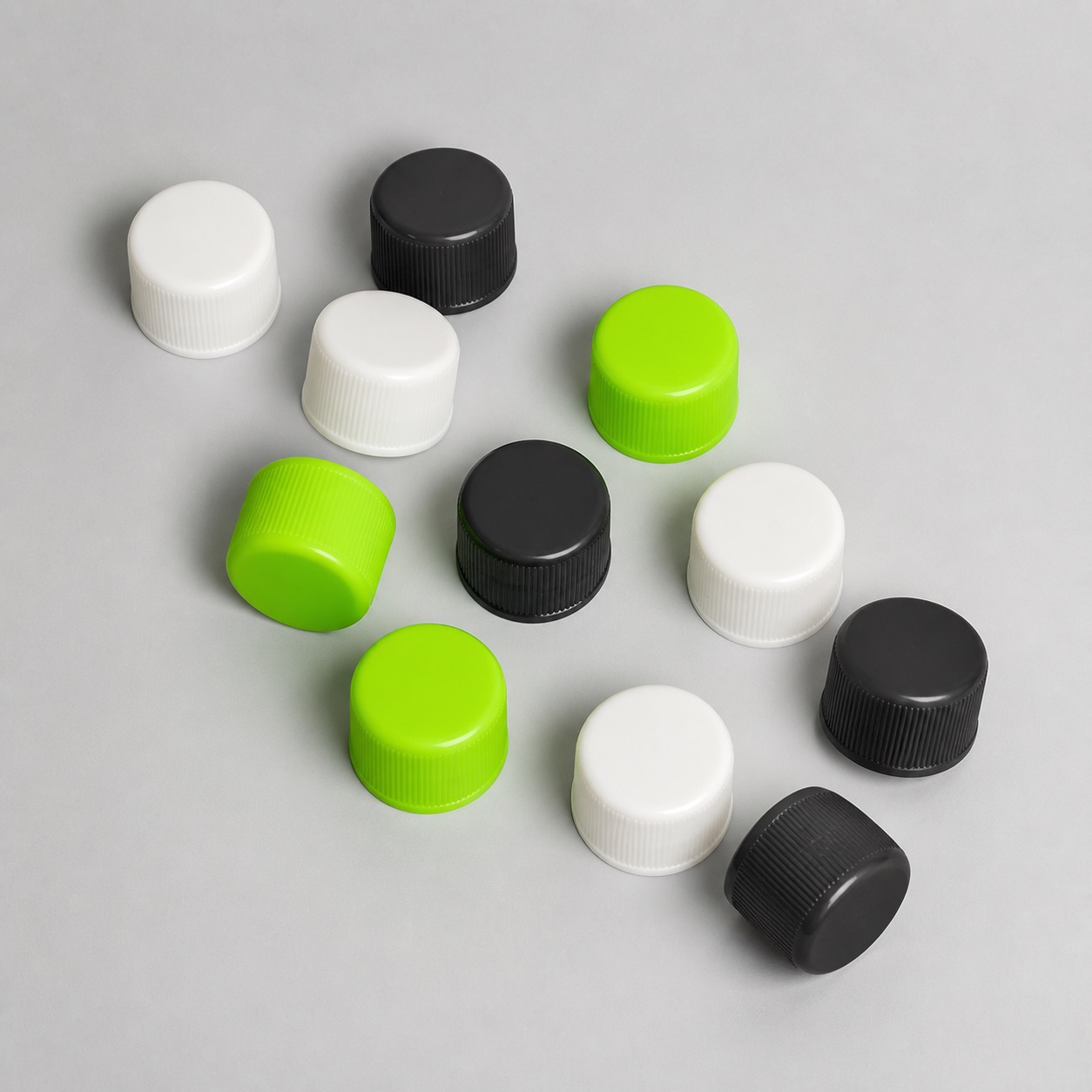 assorted-colored-ribbed-bottle-caps-overhead-view