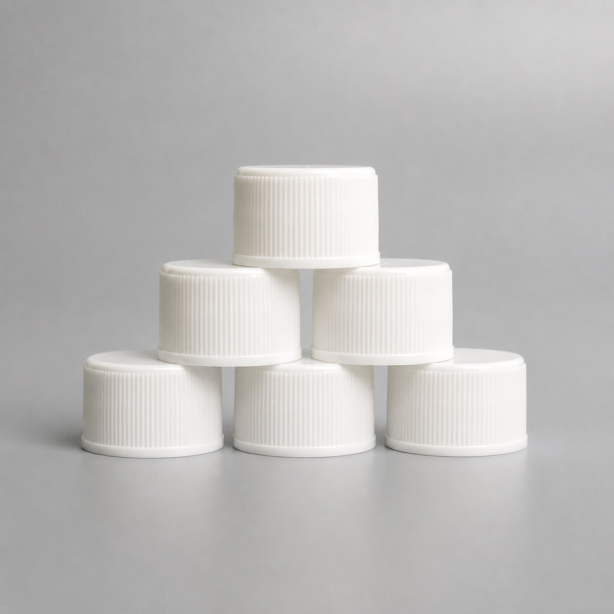 white-flat-top-packaging-caps-in-group