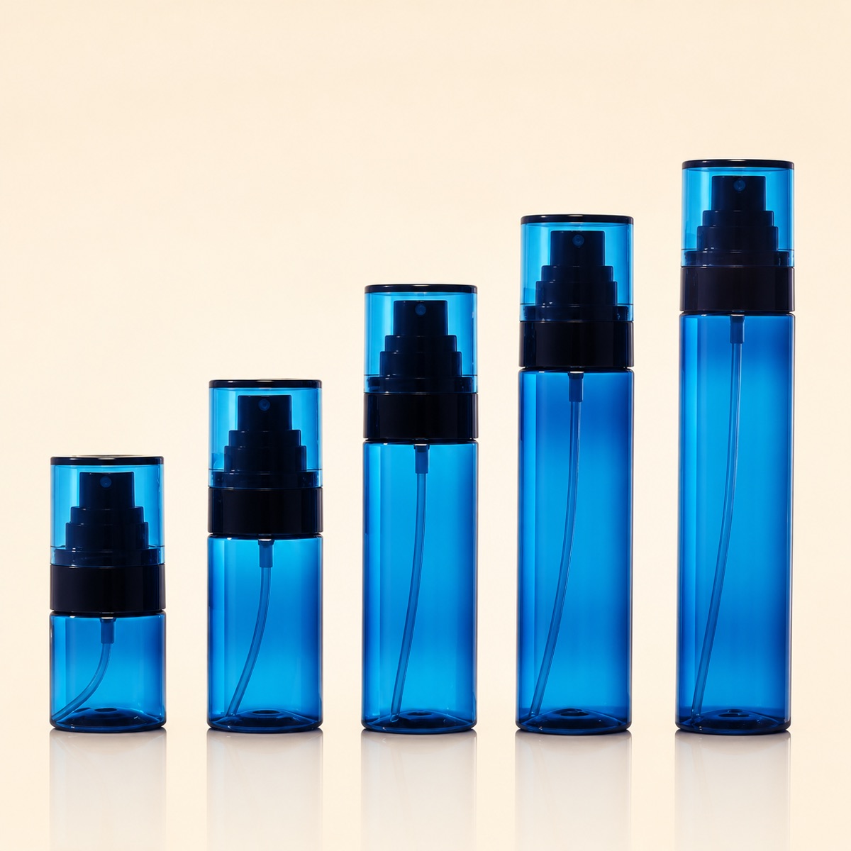 five-transparent-blue-pet-fine-mist-spray-bottles-in-ascending-sizes