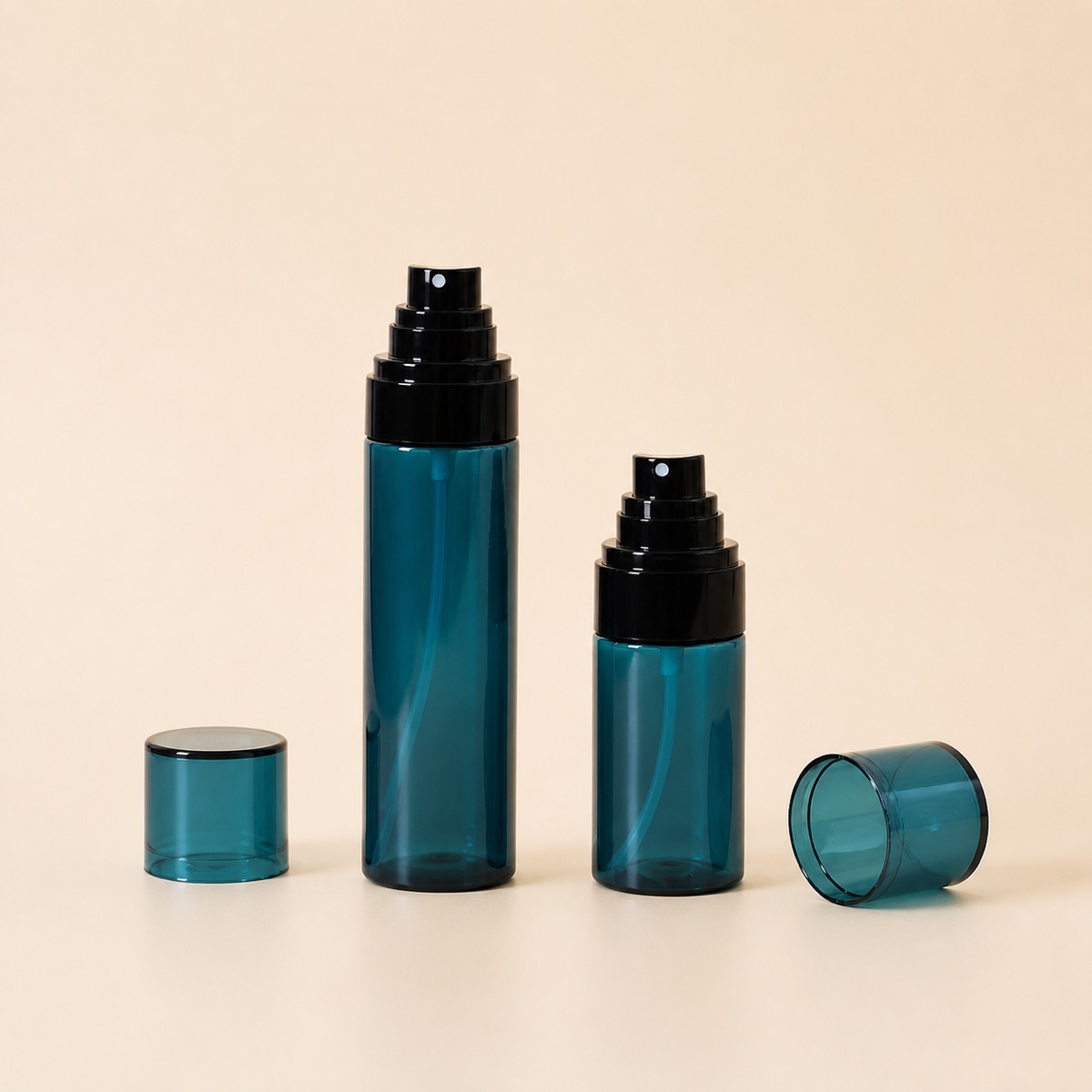 two-teal-pet-travel-spray-bottles-with-caps-removed