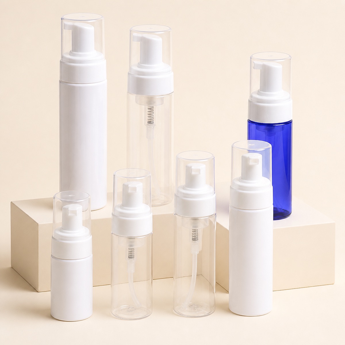 clear-white-and-blue-pet-foam-pump-bottles-on-display-blocks