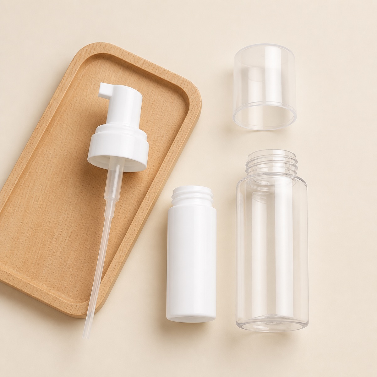 pet-foaming-pump-bottle-components-arranged-on-a-wooden-tray