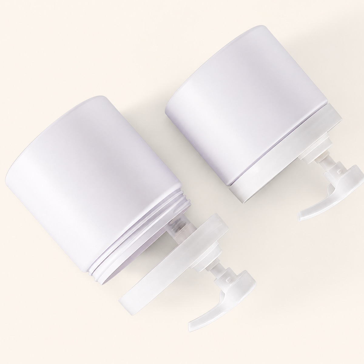 three-off-white-pet-wide-mouth-pump-jars-viewed-from-above